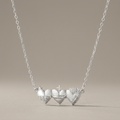 Sacred Hearts of the Holy Family Necklace in Sterling Silver